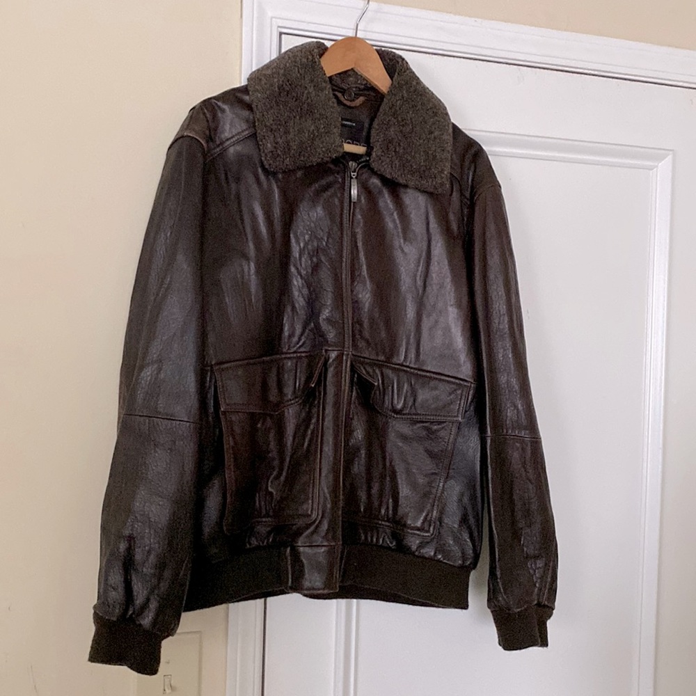Grunge-looking, zip front brown bomber jacket.